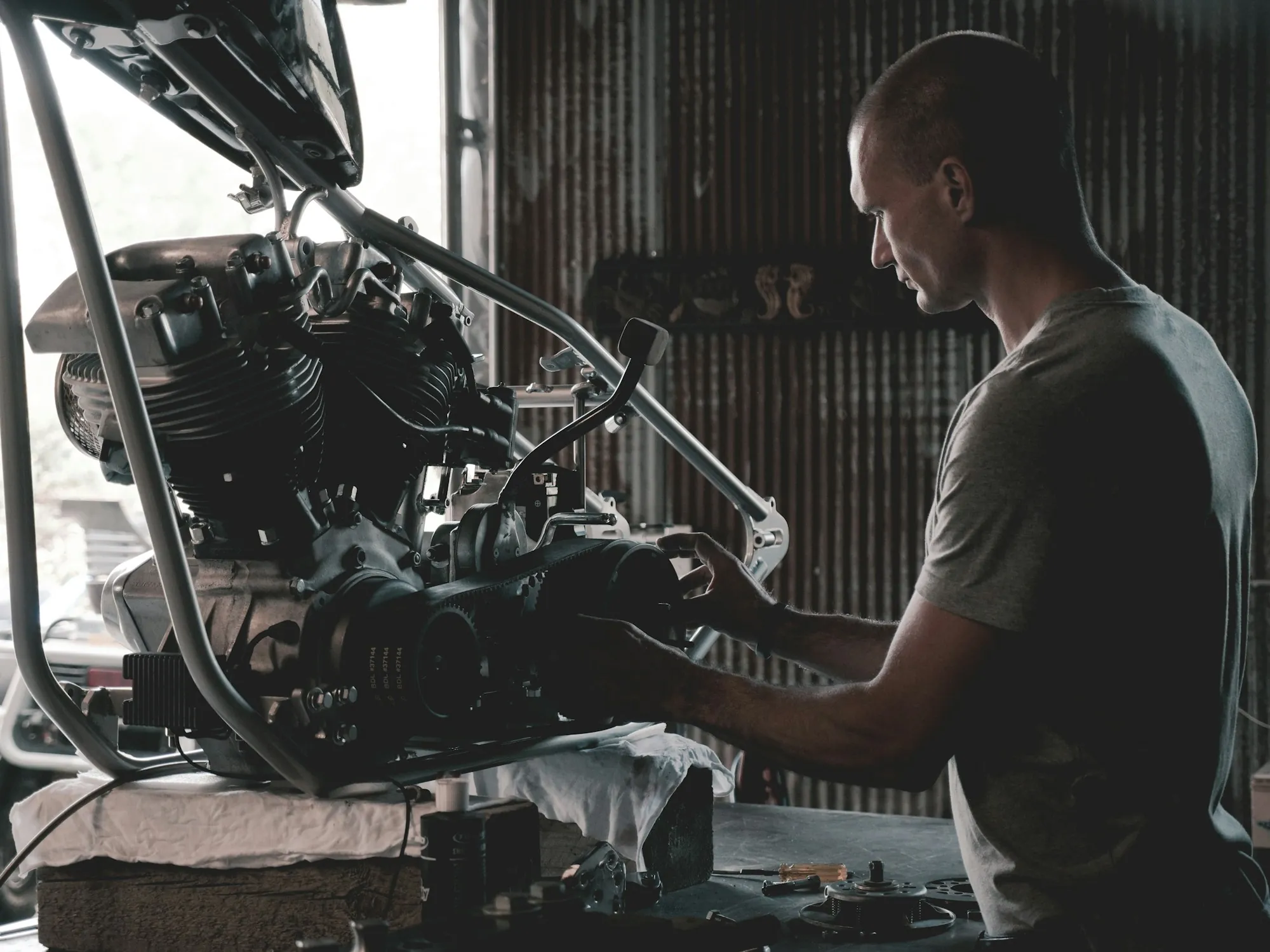 Mechanic working on an engine at a workbench