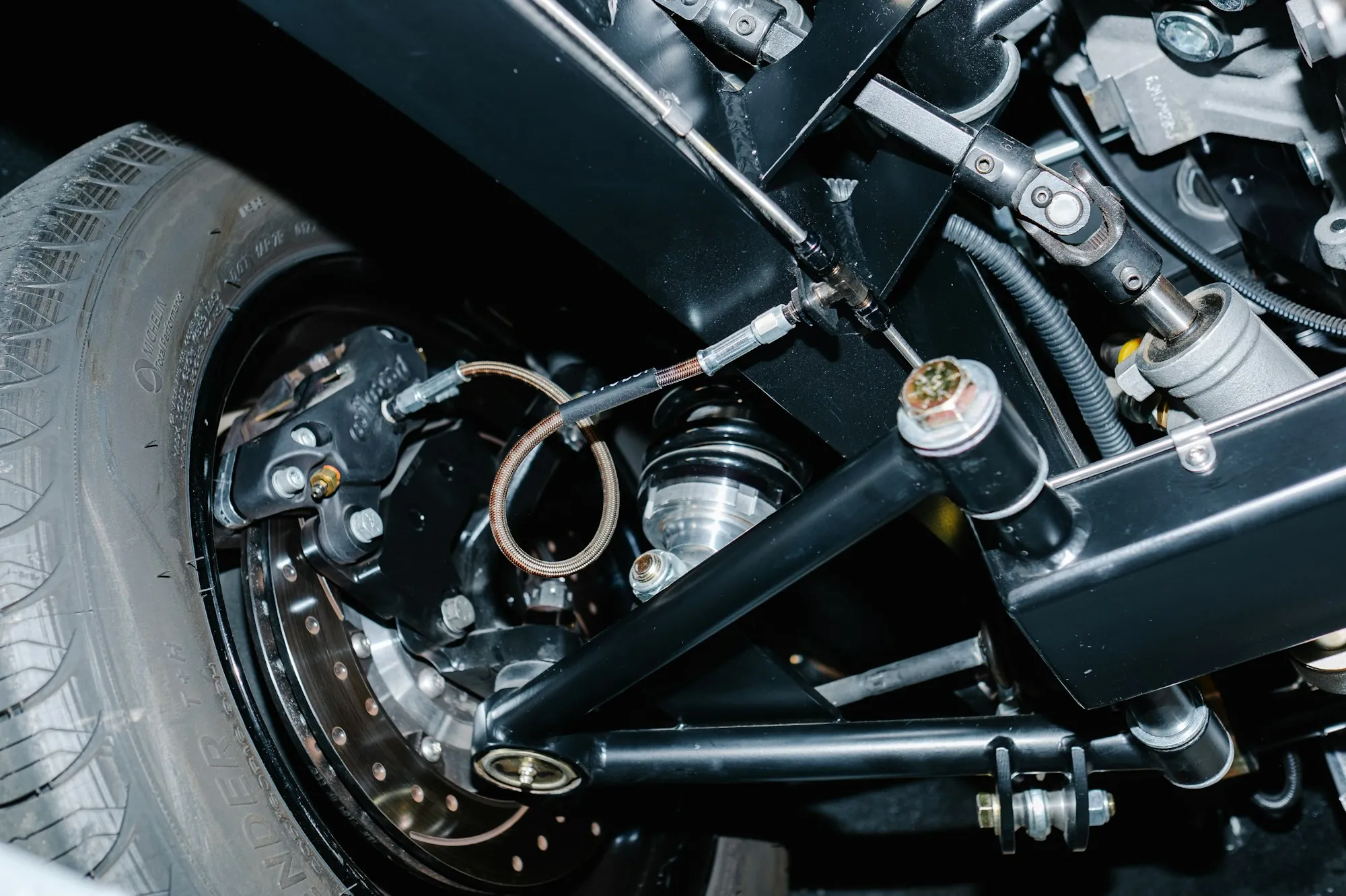 Front suspension and wheel hub assembly on a lifted vehicle